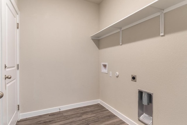 washroom with washer hookup, laundry area, baseboards, and dark wood-type flooring