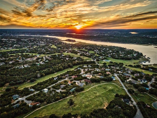 aerial view at dusk with a water view