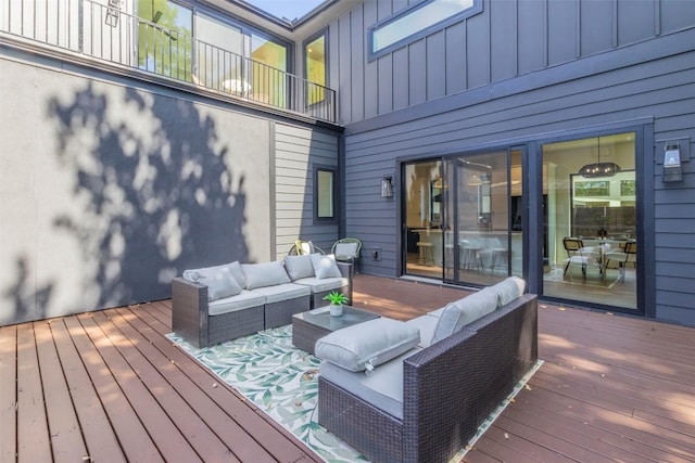 wooden terrace featuring outdoor lounge area