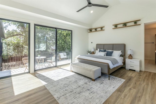 bedroom with recessed lighting, high vaulted ceiling, wood finished floors, and access to outside