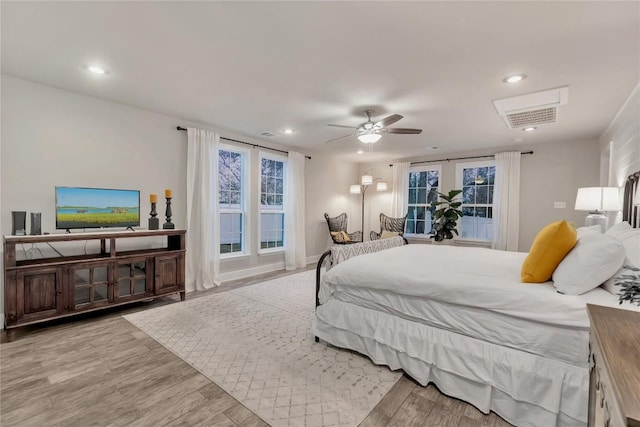 bedroom featuring a ceiling fan, recessed lighting, and wood finished floors