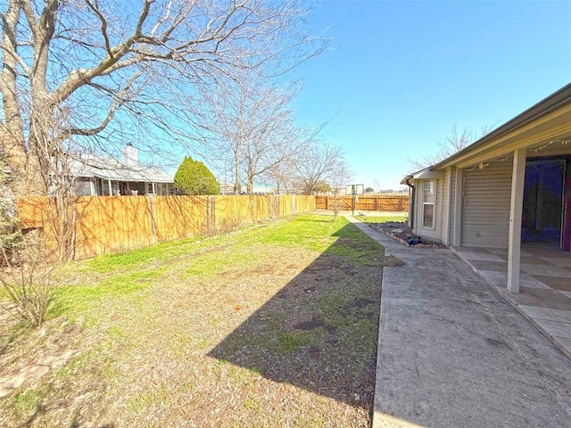 view of yard with a patio area and fence