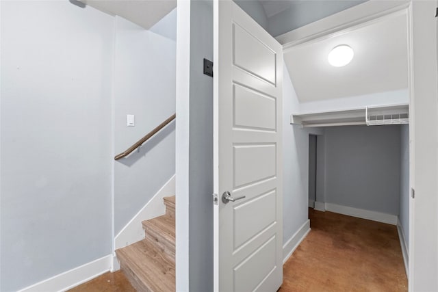 staircase featuring visible vents and baseboards