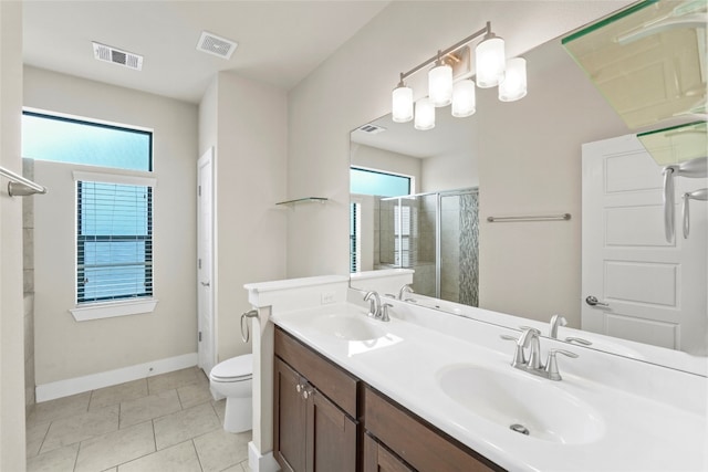 bathroom with a sink, visible vents, and a stall shower