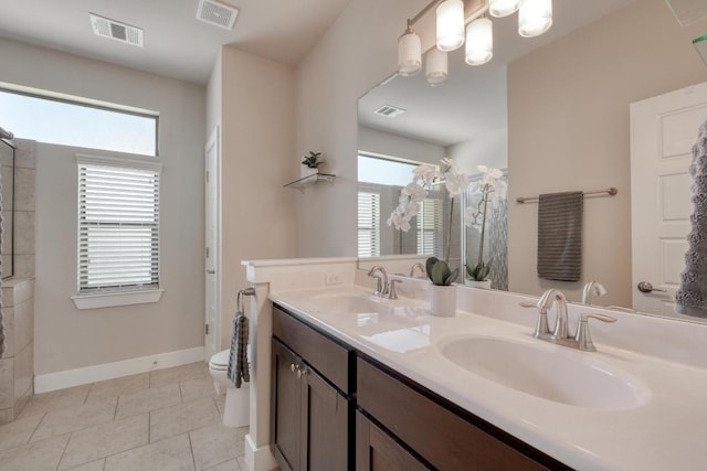 full bath with plenty of natural light, visible vents, and a sink