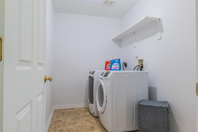 washroom featuring laundry area, independent washer and dryer, baseboards, and visible vents