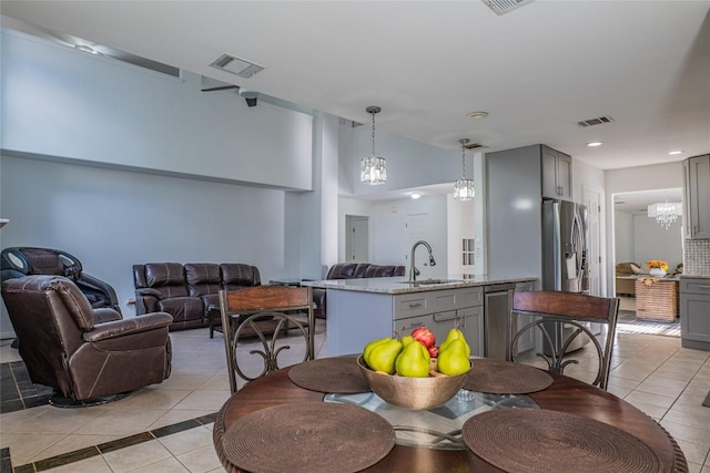 dining space with light tile patterned floors, visible vents, and recessed lighting