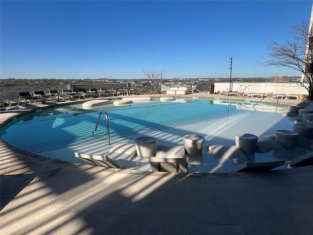 pool featuring a patio area