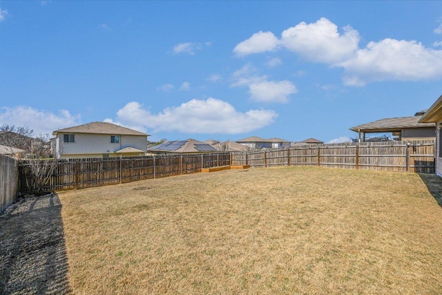 view of yard featuring a fenced backyard