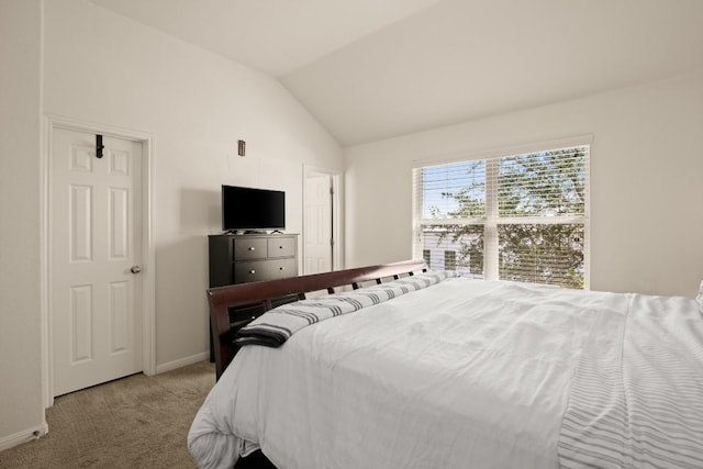 bedroom featuring vaulted ceiling, carpet, and baseboards