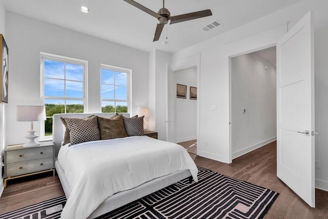 bedroom with visible vents, a ceiling fan, wood finished floors, recessed lighting, and baseboards