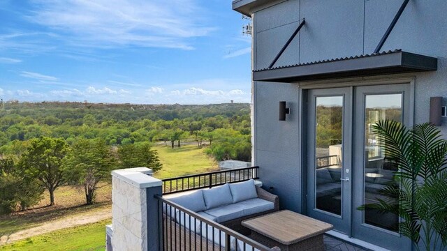 281 Pullman Ct, Round Rock, TX 78664 - balcony featuring french doors, a forest view, and outdoor lounge area