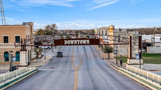 view of street featuring curbs and sidewalks