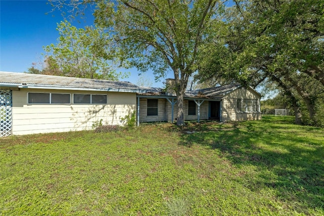 exterior space with a yard