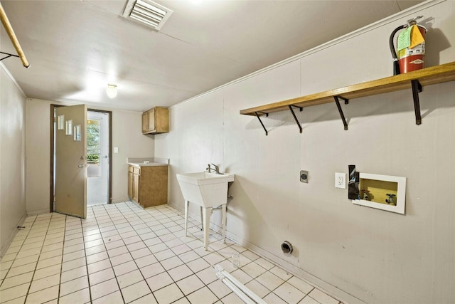 clothes washing area with visible vents, cabinet space, light tile patterned floors, hookup for an electric dryer, and hookup for a washing machine