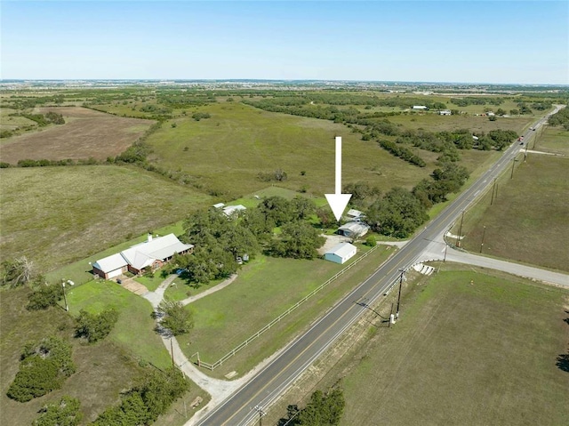 birds eye view of property featuring a rural view