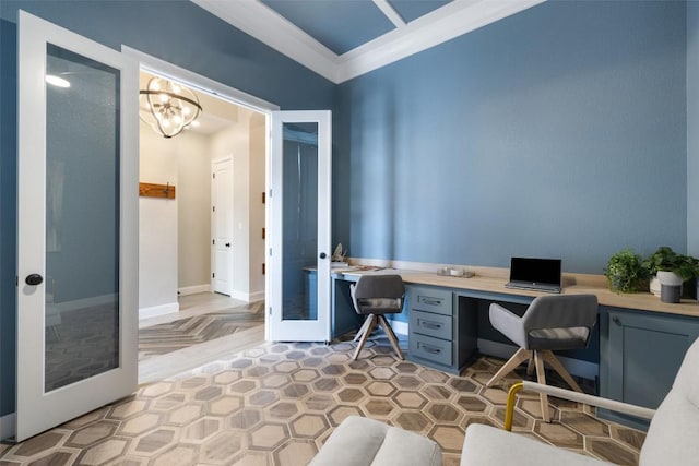 office area featuring baseboards, built in study area, ornamental molding, french doors, and a chandelier