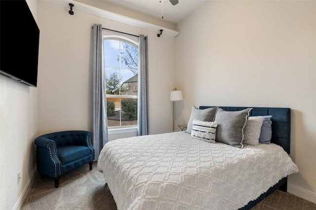 bedroom with carpet and baseboards