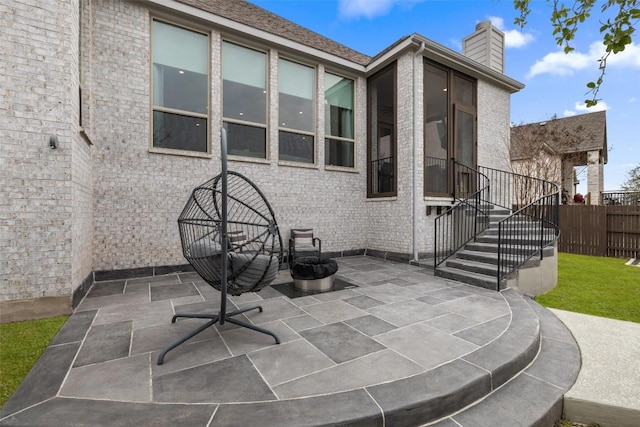 view of patio featuring fence