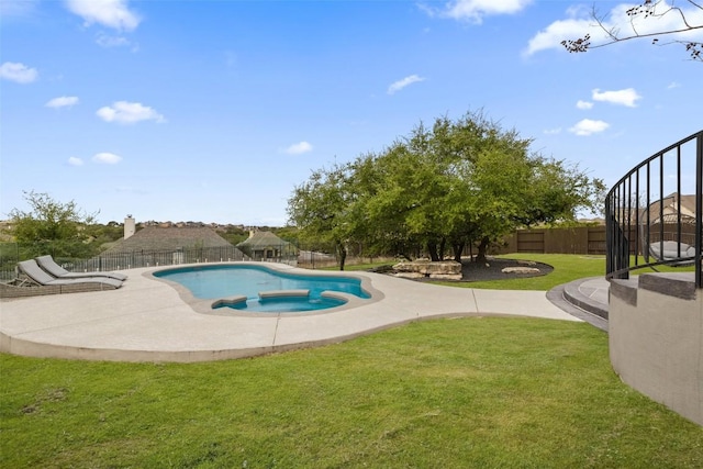 view of pool with a fenced in pool, a lawn, a fenced backyard, and a patio area