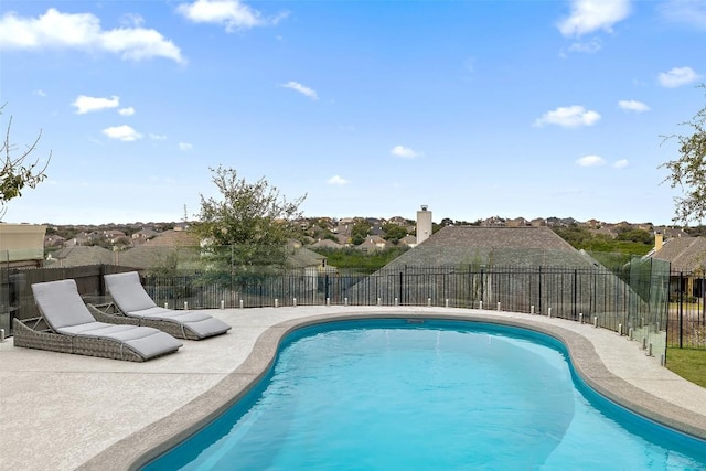 view of swimming pool featuring a fenced in pool, a patio, and fence