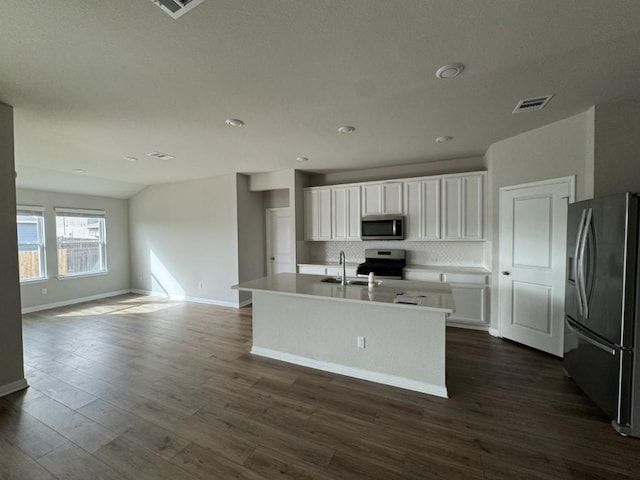 kitchen with white cabinetry, dark wood-type flooring, visible vents, and stainless steel appliances