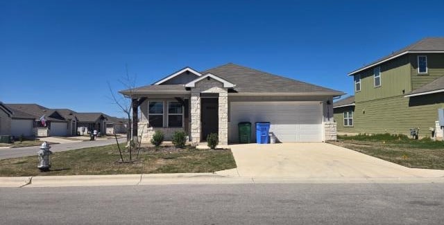 view of front of house featuring an attached garage and driveway