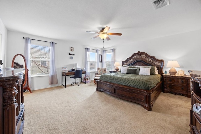 9017 Edmundsbury Dr, Austin, TX 78747 - bedroom featuring light carpet, a desk, and a ceiling fan