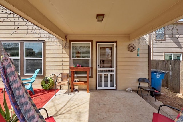 view of patio / terrace featuring fence