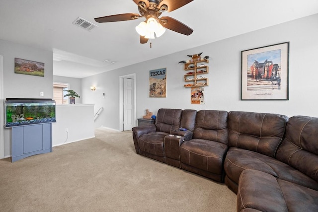 carpeted living room featuring visible vents and a ceiling fan