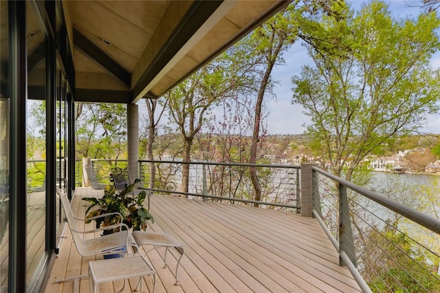 wooden deck with a water view