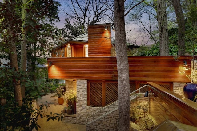 exterior space featuring stone siding