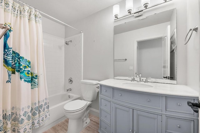 bathroom featuring shower / bathtub combination with curtain, toilet, vanity, and wood finished floors