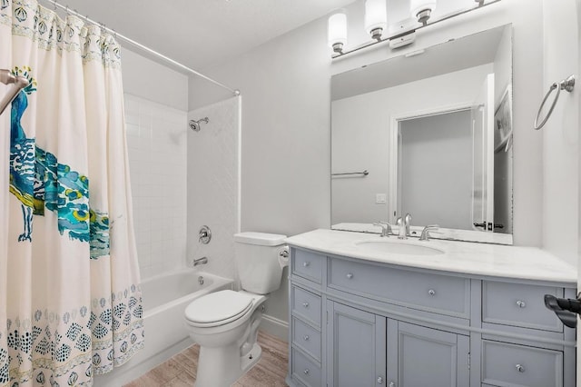 6303 Sam Maverick Pass, Austin, TX 78749 - full bath featuring vanity, toilet, shower / bath combo with shower curtain, and wood finished floors