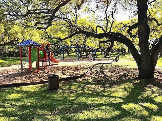 6303 Sam Maverick Pass, Austin, TX 78749 - surrounding community with a lawn
