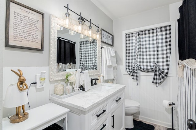 full bath featuring toilet and vanity