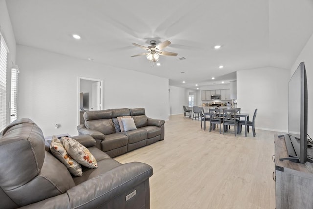 living room featuring plenty of natural light, recessed lighting, and light wood finished floors