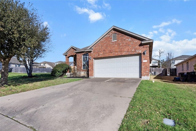 view of front of house with brick siding, driveway, a front yard, and fence