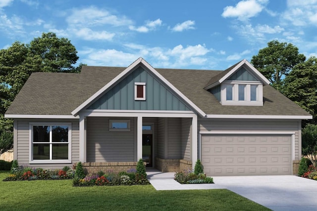 craftsman inspired home with board and batten siding, a front yard, concrete driveway, and a garage