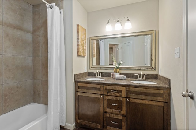 full bath featuring shower / bath combination with curtain, double vanity, and a sink