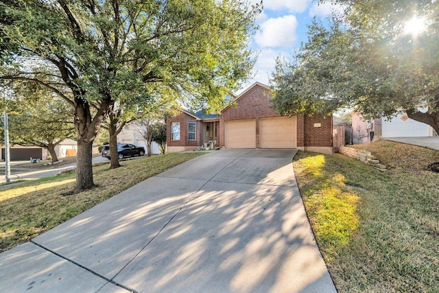 ranch-style home with a front lawn, an attached garage, brick siding, and driveway