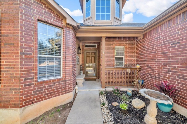 property entrance with brick siding