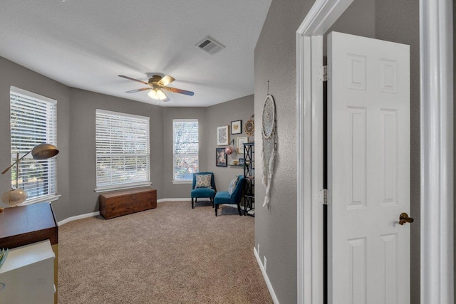 2157 Paradise Ridge Dr, Round Rock, TX 78665 - living area featuring ceiling fan, carpet floors, and baseboards