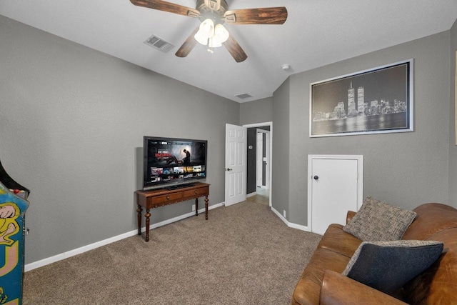 living area with visible vents, carpet floors, and baseboards