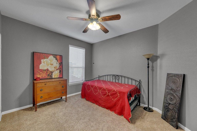 bedroom featuring ceiling fan, baseboards, and carpet floors