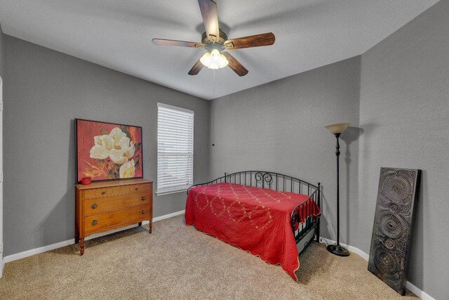 2157 Paradise Ridge Dr, Round Rock, TX 78665 - carpeted bedroom with ceiling fan and baseboards