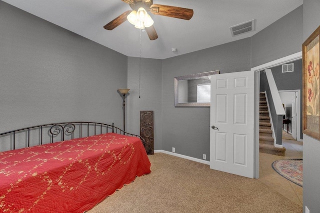 bedroom with visible vents, carpet flooring, a ceiling fan, and baseboards