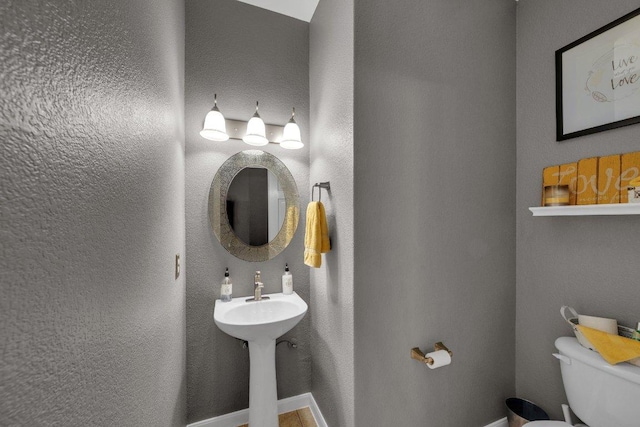 2157 Paradise Ridge Dr, Round Rock, TX 78665 - half bath with toilet, a sink, and baseboards