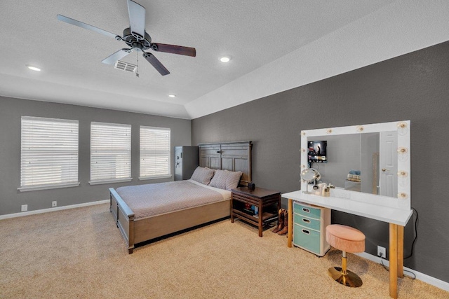 bedroom with light carpet, visible vents, baseboards, and vaulted ceiling