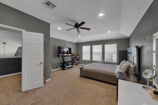 carpeted bedroom with baseboards, visible vents, recessed lighting, a textured ceiling, and a textured wall